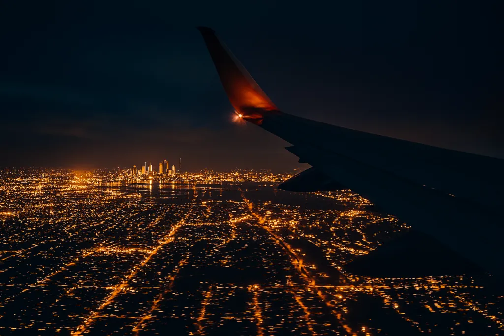 Airplane view of city skyline at night