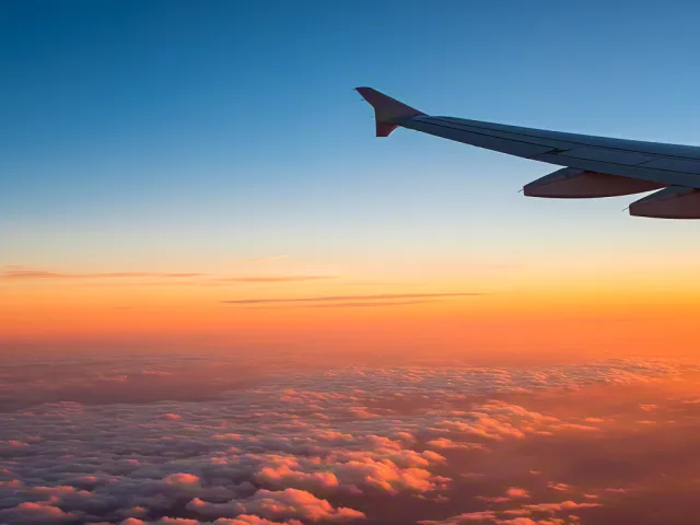 View from airplane window during sunset