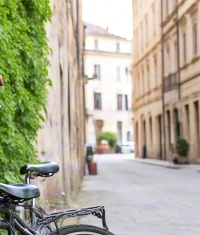 Black bicycle on quiet European cobblestone street