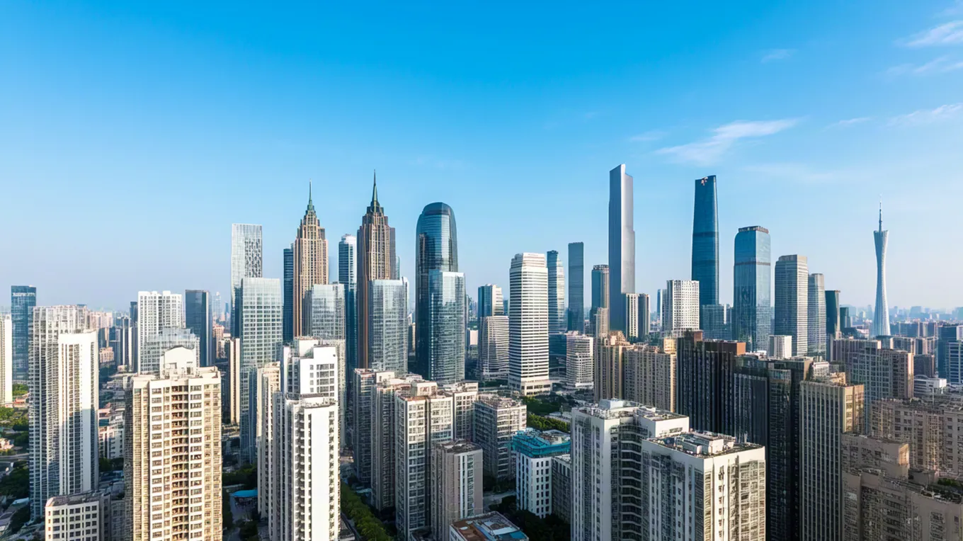 Panoramic cityscape with tall buildings under clear blue daylight