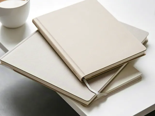 Minimalist notebook and coffee on desk