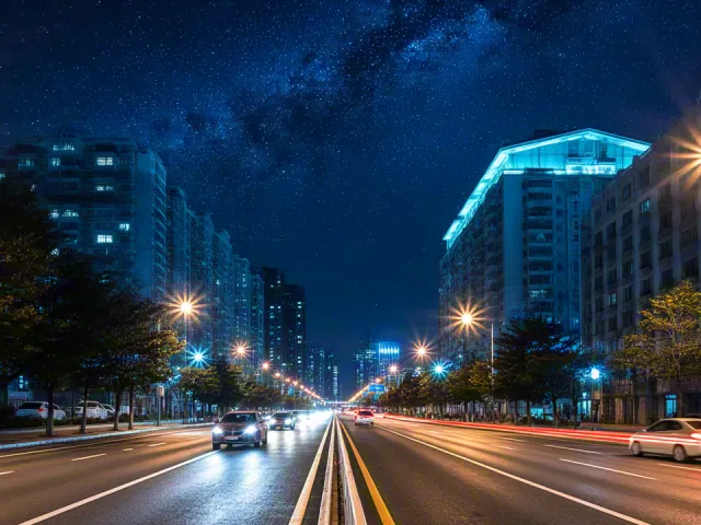 Long-exposure city road with neon lights
