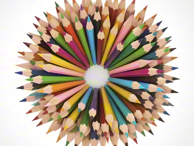 reative art composition of colored pencils forming vibrant mandala shape.