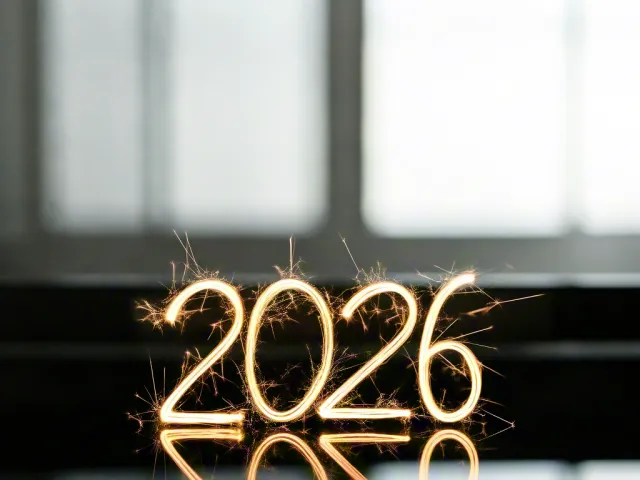 illuminated 2026 typography glowing in front of window