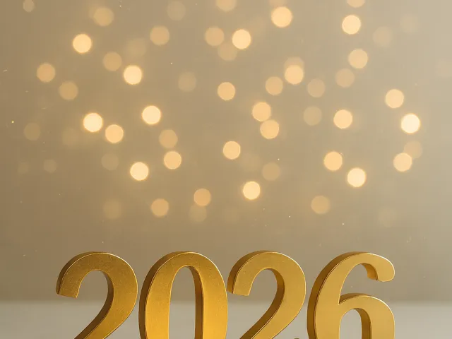 Soft glowing 2026 typography over warm golden bokeh lights