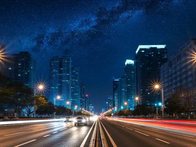 Blurred night traffic lights in cityscape