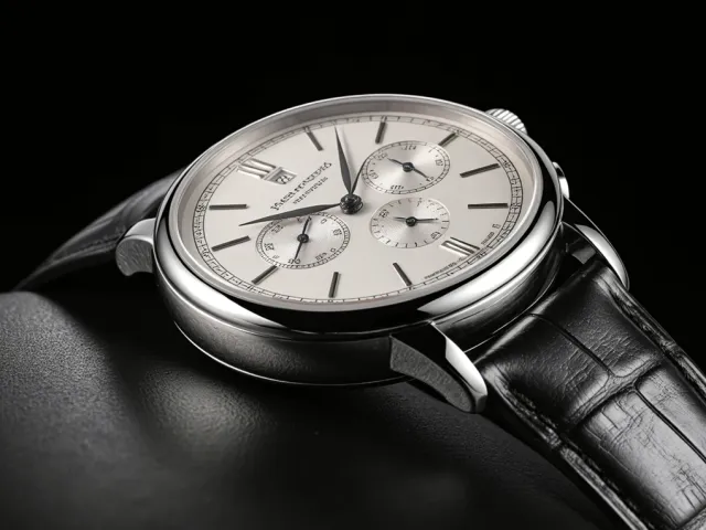 Close-up of elegant wristwatch on dark background