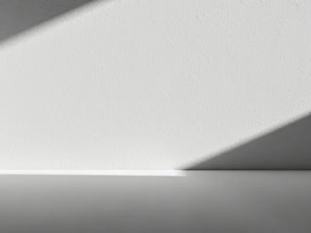 simple light grey background with diagonal soft shadows