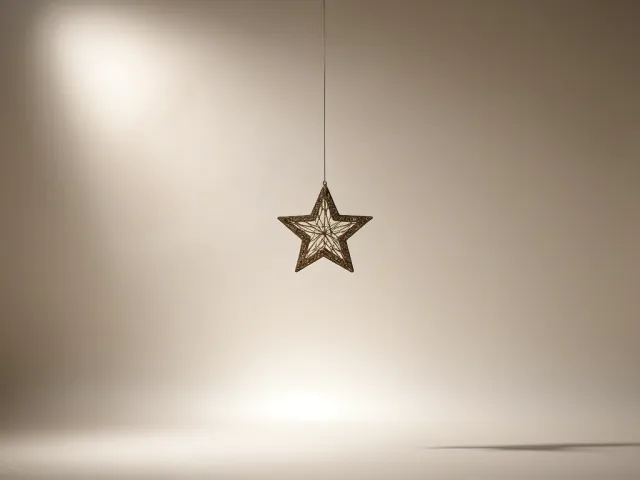 simple golden star hanging on soft festive background