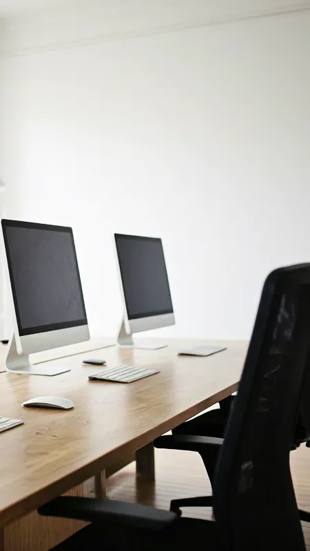 Minimalist office workspace with computers