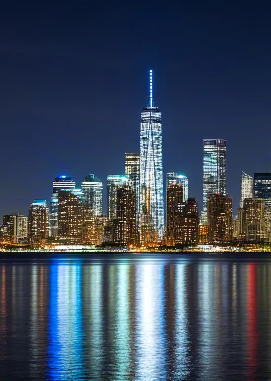 Modern skyline at twilight with city reflections