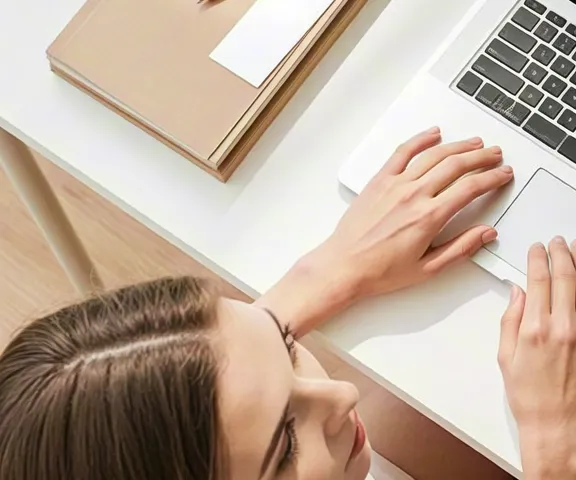 Minimalist overhead view of laptop, notebook and office accessories on desk