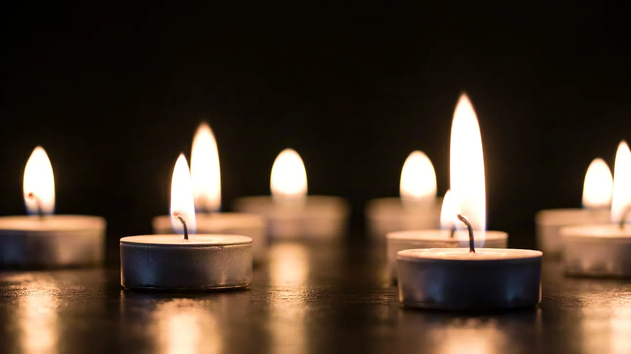 Close-up of lit candles creating peaceful mood lighting.