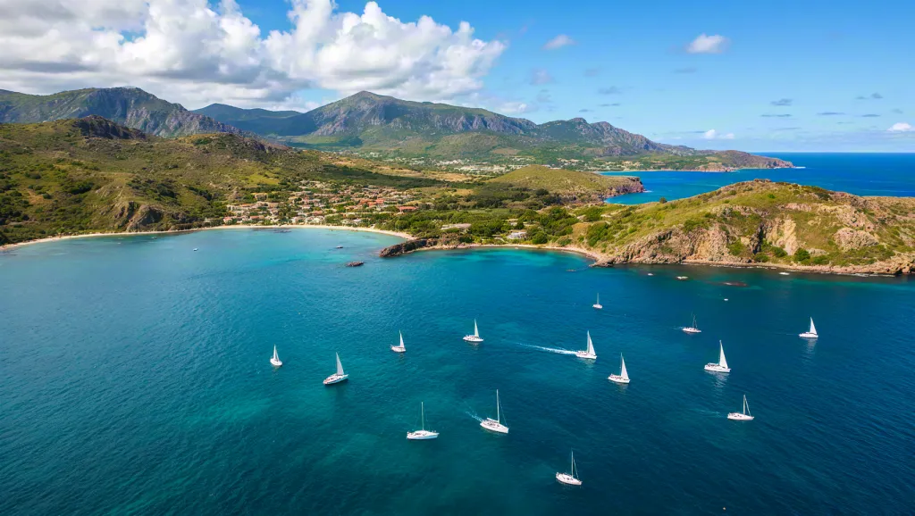 Sailboats on tropical blue bay