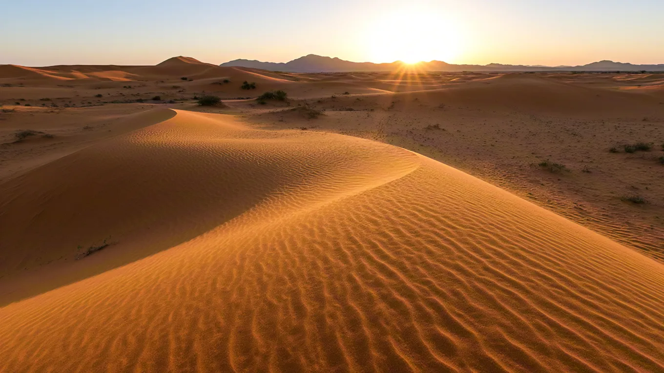 Glowing sand dunes under early morning light