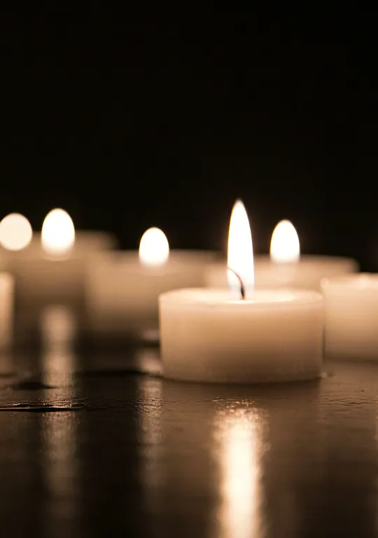 Soft glowing candles symbolizing peace and reflection