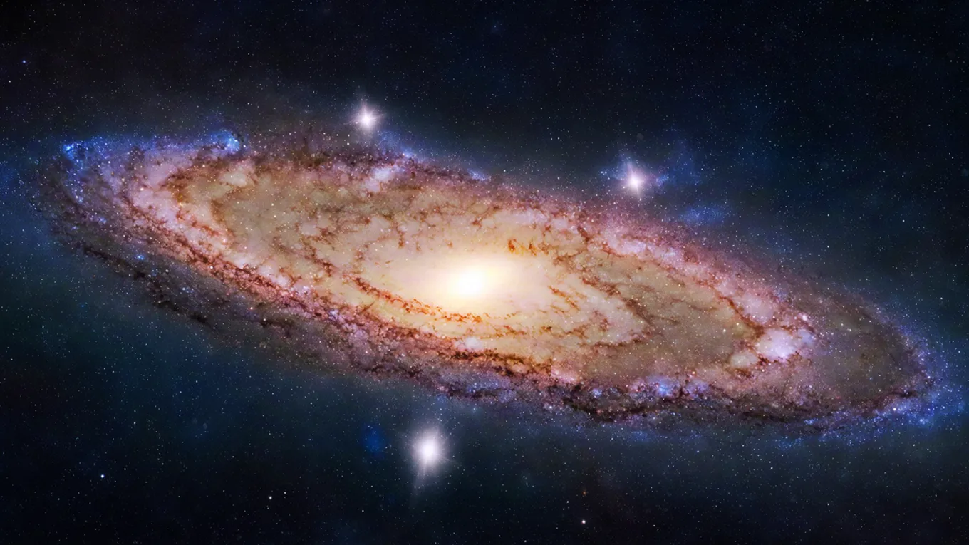 Spiral galaxy glowing with stars and dust clouds
