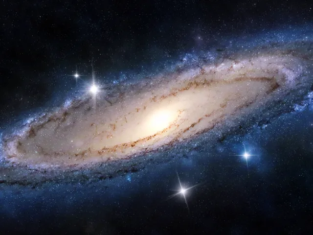 wide view of a spiral galaxy surrounded by stars
