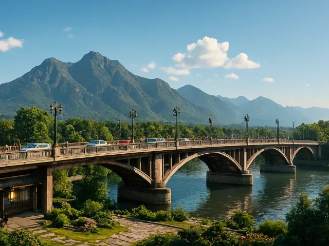 old stone bridge crossing a calm river