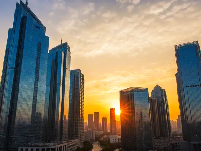 Tall city towers glowing at golden hour