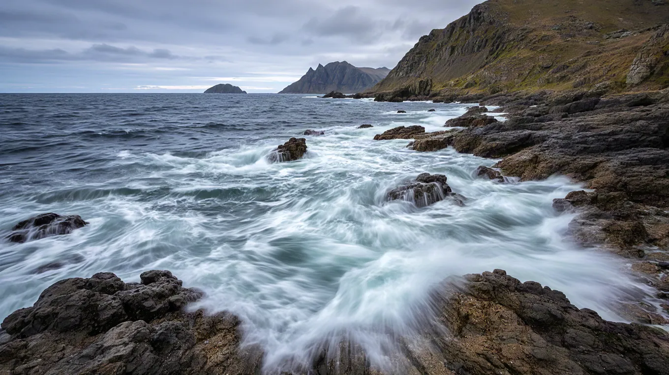 Long exposure waves hitting coastal rocks