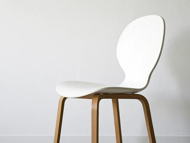 Simple white chair in clean minimalist room