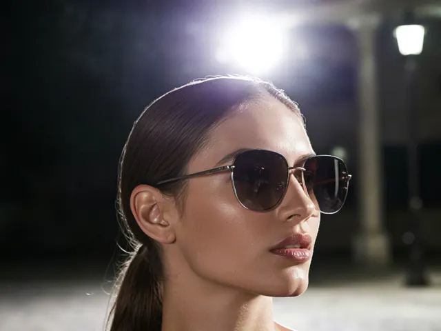 Portrait of woman with sunglasses in city lights