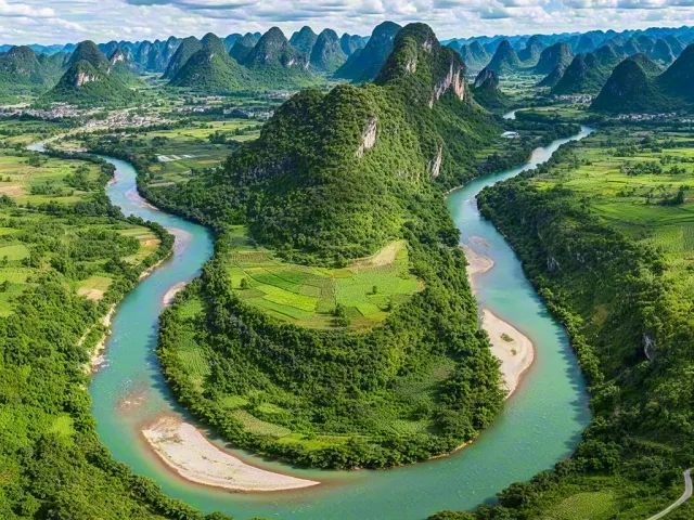 Scenic aerial landscape of lush green valley with winding river