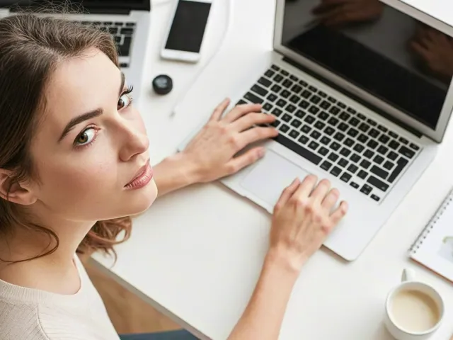 Woman working on laptop at modern workspace